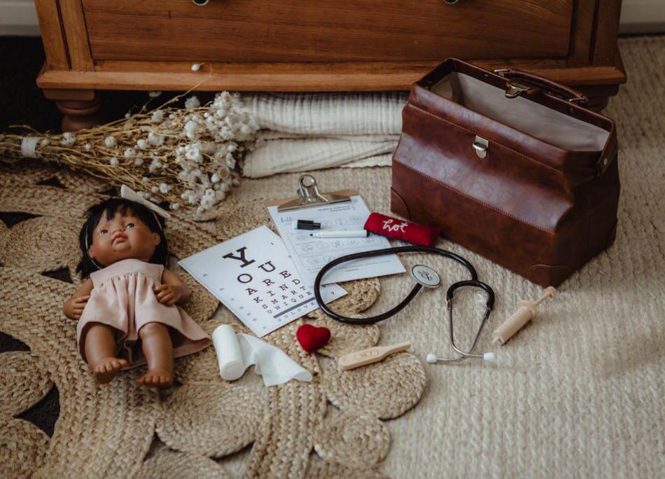 children playing with wooden potion tools